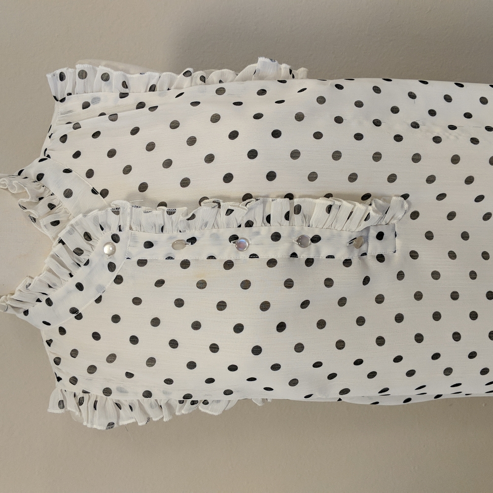 Sleeveless white/black polkadot blouse,ruffles around neck and armholes XL